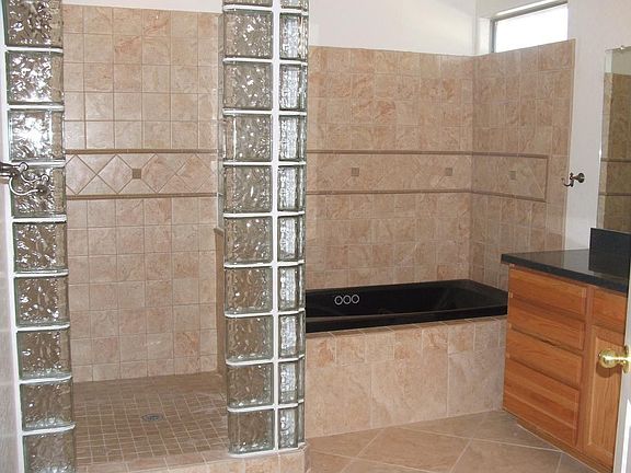 Imported porcelin tile master bath with jacuzzi tub and walk in shower
