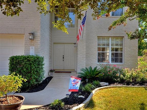 Enjoy the beautiful landscaping that leads to your double door entry.