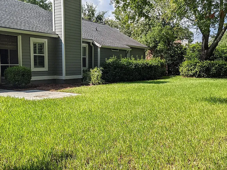 professionally maintained yard with sprinkler system