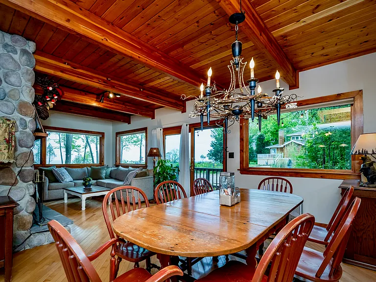 Charming, light-filled retreat just moments from Lake Michigan, offering a perfect blend of warmth, comfort, and inviting indoor-outdoor living.