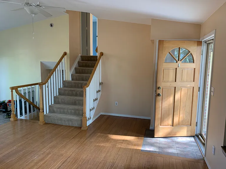 Entry way with nine stairs to upstairs and four stairs to lower level