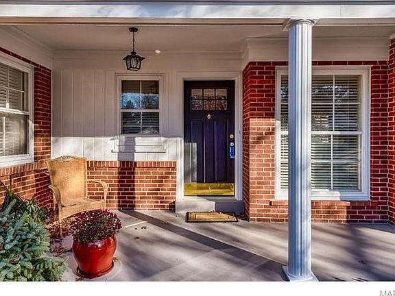 Space for sitting on the covered porch. Door has been freshened with new hardware and kick plate.