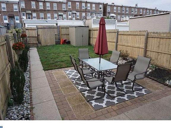 Fenced in Back yard with parking spot behind fence - great f