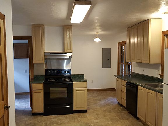 Large Kitchen with small eat-in area overlooking porch