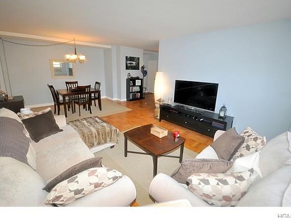 The sunny living room has views of tree lined Garth Road and has parquet floors.  The room is 22'-0" x 13'-0".