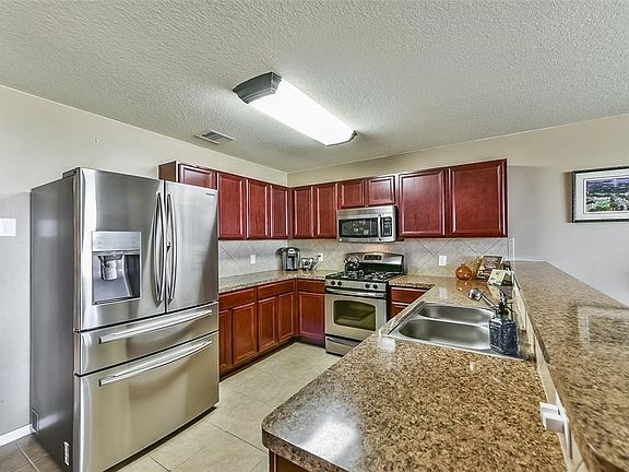 Gourmet Kitchen Features Stainless Steel Appliances