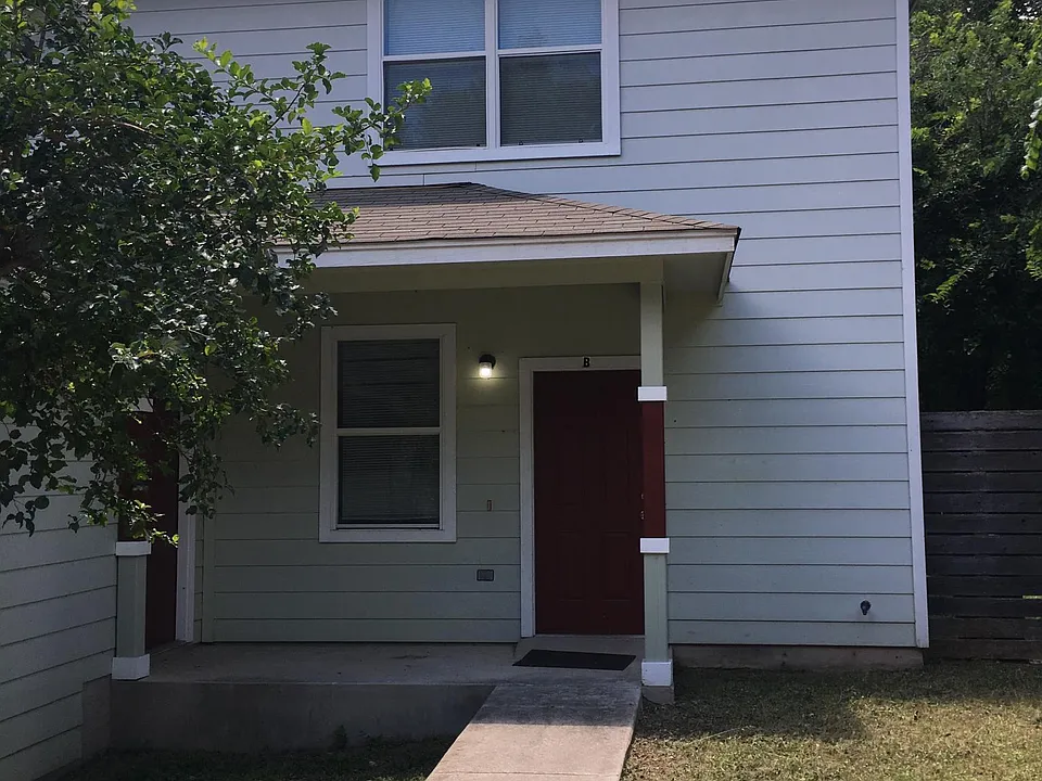 Front door and porch, storage unit is door in the corner to the left.