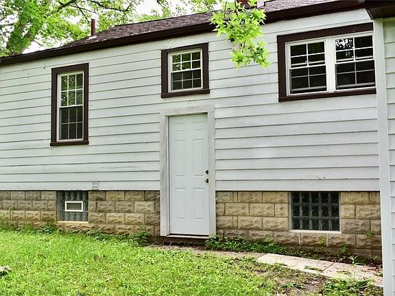 View of the back of the house. New door.