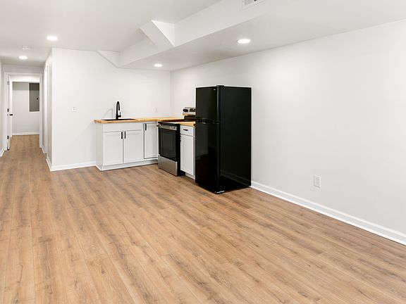 Kitchen area extends into dining/living room space.