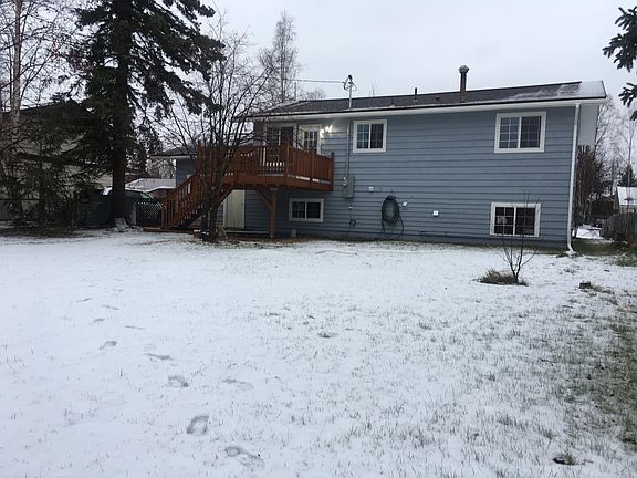 back of the house with large fenced back yard