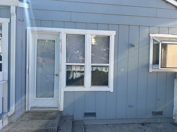 Door from dining area to private patio.