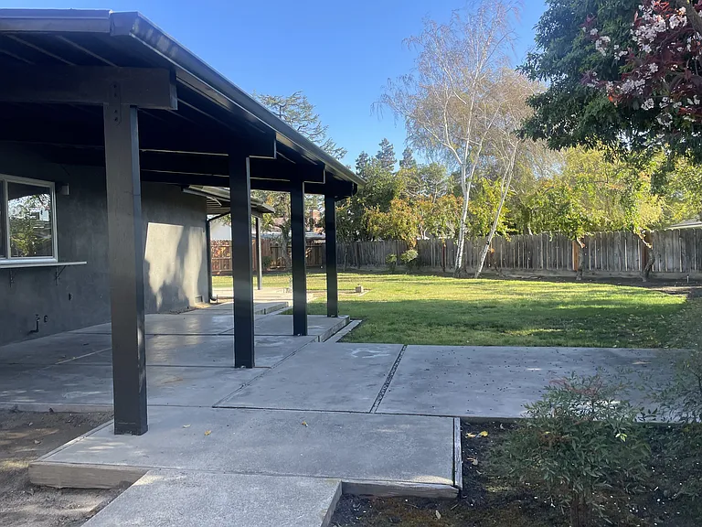 Side yard with covered patio