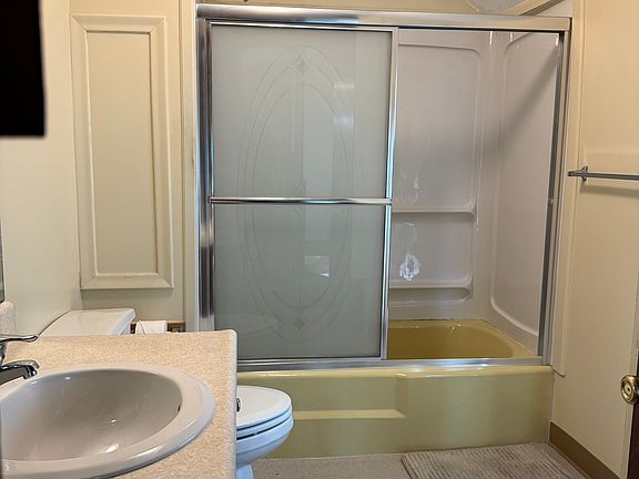 Shower with glass sliding door