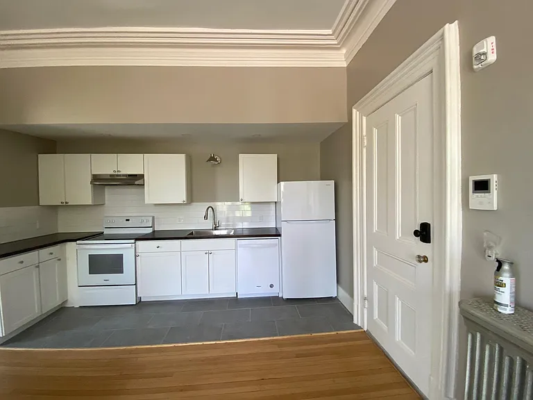 Front door on right, Crown mouldings, heat is hot water/radiator.