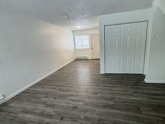 Living area with laundry area doors closed