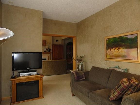 The sunroom shows off custom wall art.