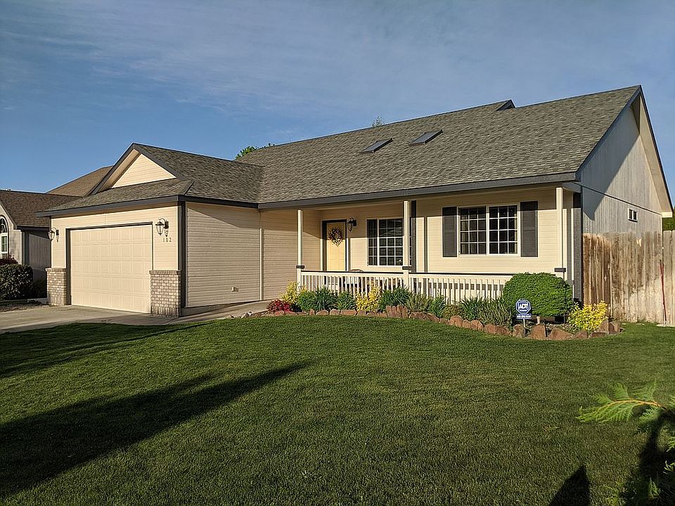 Curbside view. New exterior paint