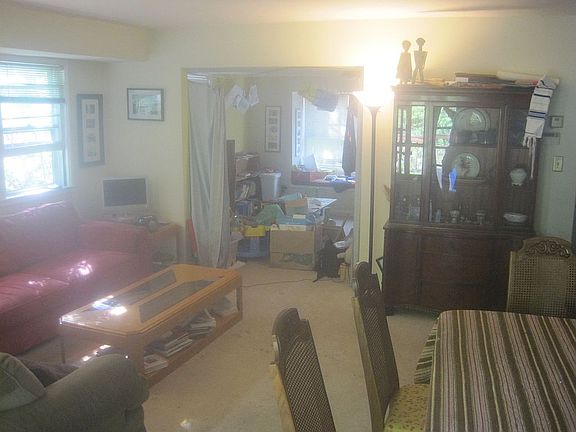 Living room opens to den