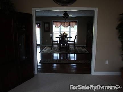 side walkout featuring specialty double French doors