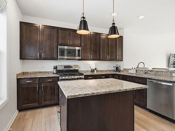 Updated fixtures, stainless steel appliances, and lots of natural light.
