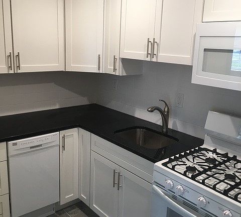 Kitchen with gas range and microwave