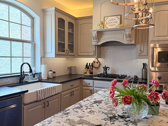 Updated kitchen with Viking gas cooktop, warming drawer, microwave and refrigerator. 
Farm sink and Bosch dishwasher. Walk in pantry.