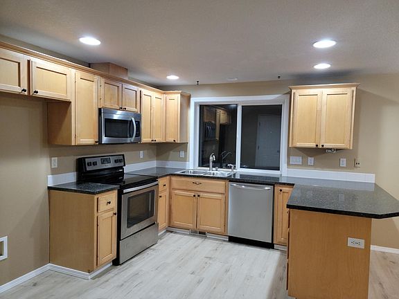 Kitchen. Please bring your own refrigerator. We have a white refrigerator for rent if needed temporarily.