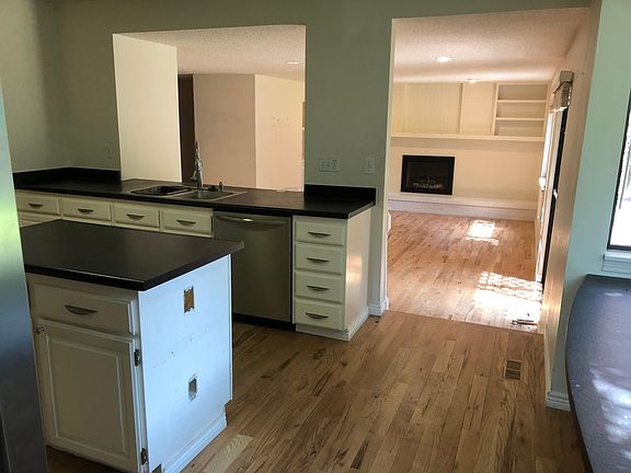 Kitchen overlooking the family room with door to back yard.