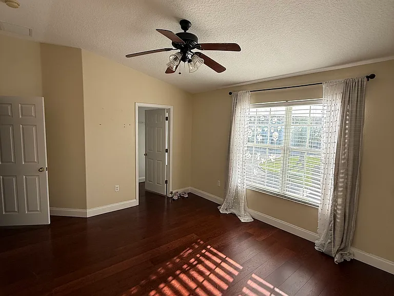 Master bedroom with walk in closet and master bathroom
