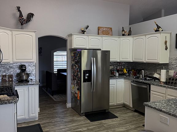 Functional kitchen with plenty of cabinet and counter space.