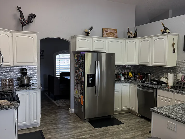 Functional kitchen with plenty of cabinet and counter space.