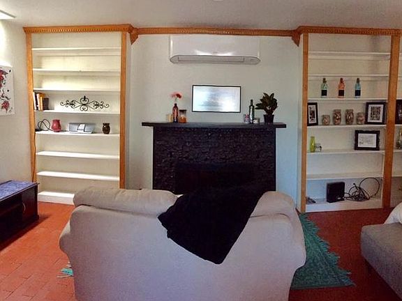 Nick/nack/bookcases and cozy fireplace sitting area