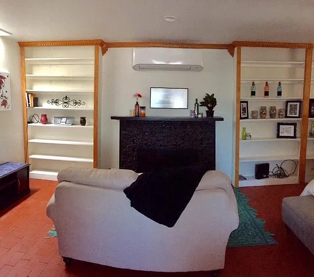 Nick/nack/bookcases and cozy fireplace sitting area