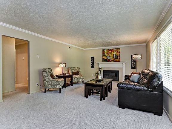 Spacious formal living area with gas fireplace