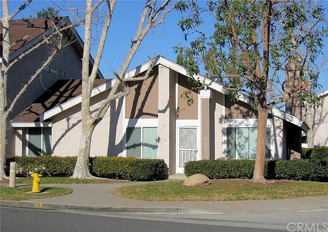 Hard to find single story, end unit, town home w/large rear patio yard and 2 car garage!
