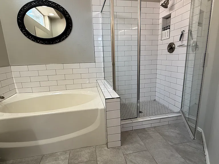 Oversized tub and subw tile shower in master bath.
