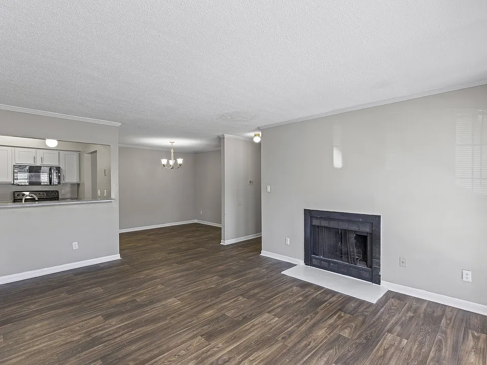 Cozy living spaces feature fireplaces and beautiful wood flooring for comfortable entertaining, professionally operated by Highlands Vista Group.