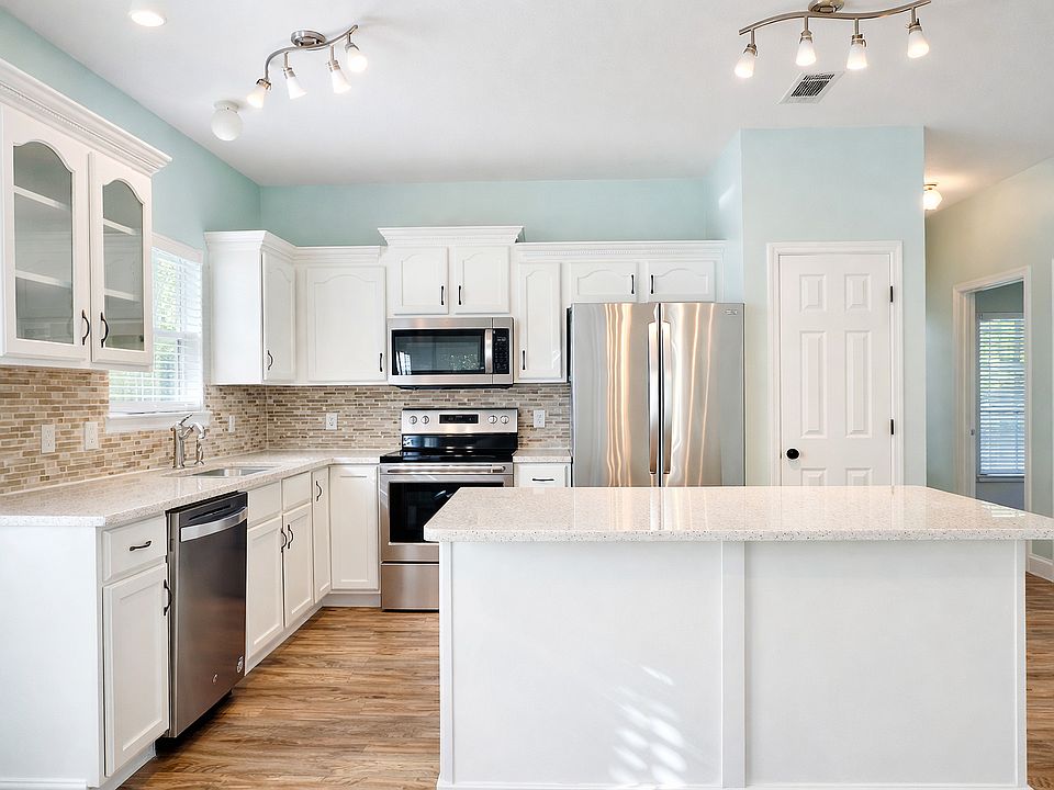 Photo of the kitchen area showing the general layout. The photo was taken from dining area.
