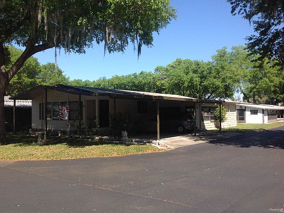 Front of Home w/ Attached Carport