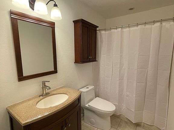 Freshly painted bright white bathroom with brand new premium designer fixtures & toilet.