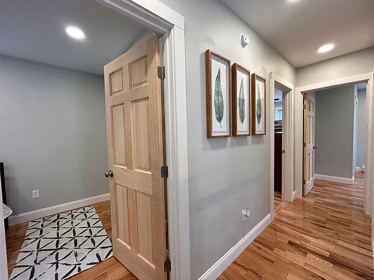 Hallway upstairs leading to bedrooms. Master off to the left, two bedrooms at the end of the hall. On the right (out of view) is full size bathroom.