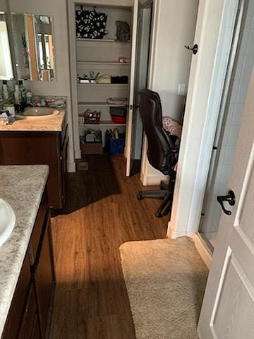 Five piece Master Suite with dual sinks, walk in closet (not seen in picture, to the left), private potty and a dressing desk.