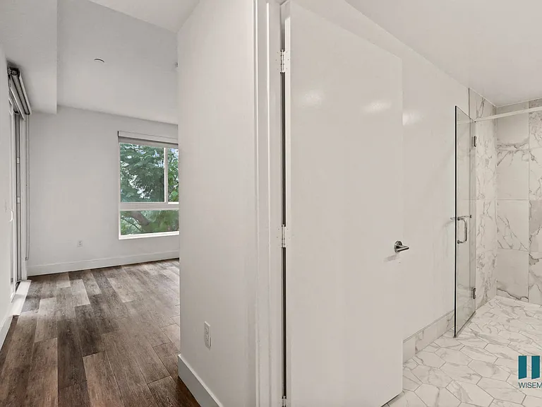 Bedroom with Bathroom, Patio, and Vinyl Flooring