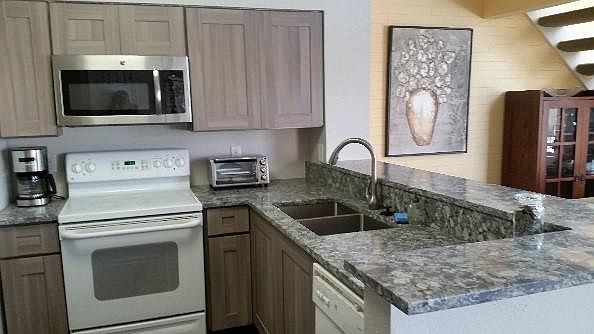 Kitchen (with slab quartz countertop & new cabinets)