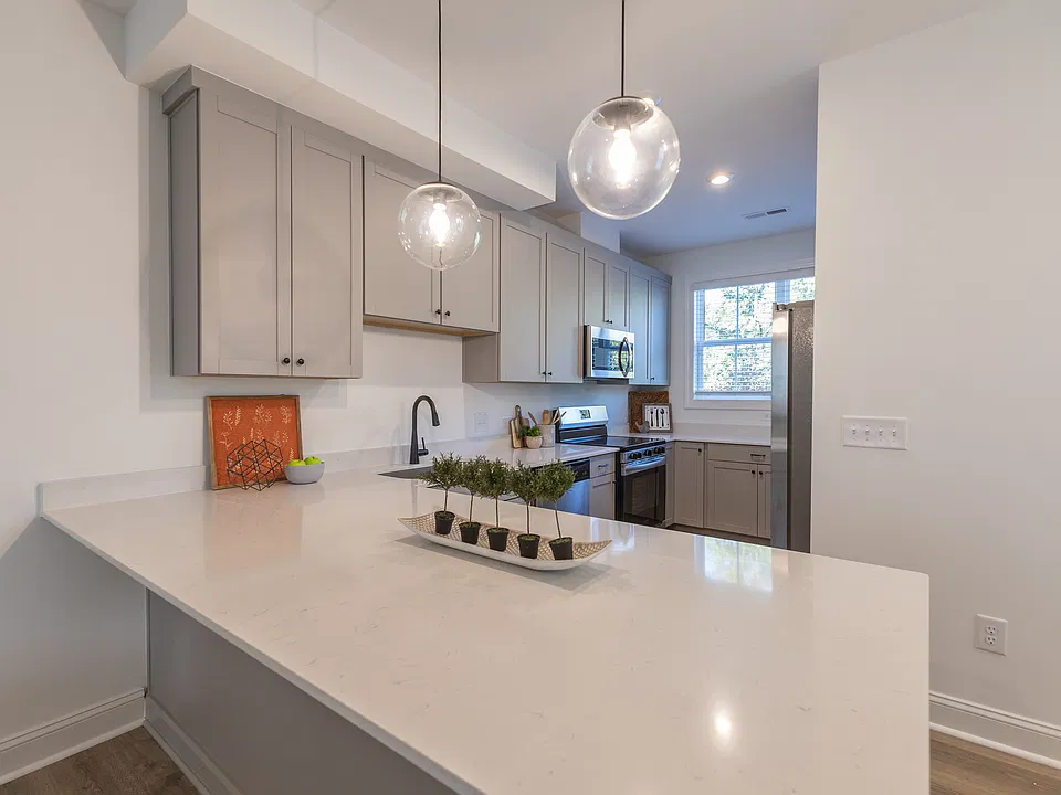 Large kitchen with quartz countertops