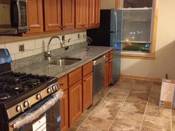 Kitchen: stainless steel stove, Fridge, microwave/vent and dishwasher. Note all the windows are double hung double paned glass.