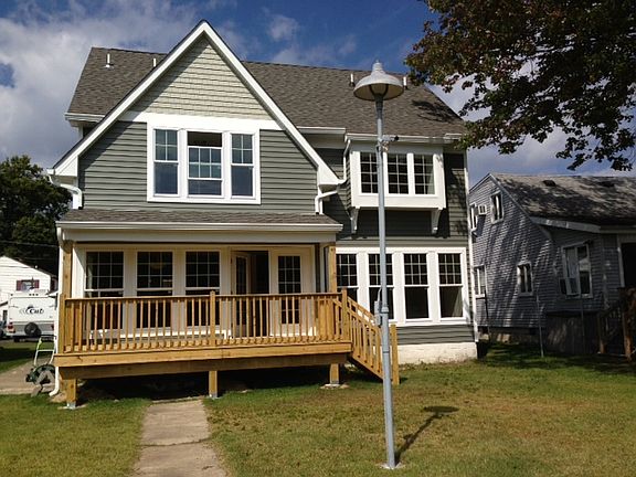 Covered porch overlooks lake