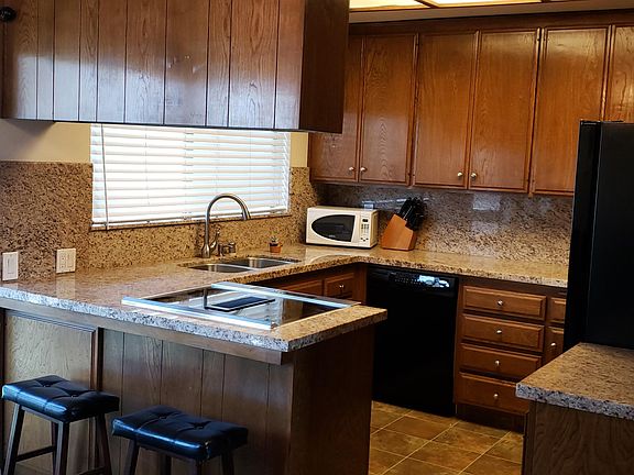 New granite, Fridge, Kitchen-Aid cook top & Diswasher and Trash Compactor