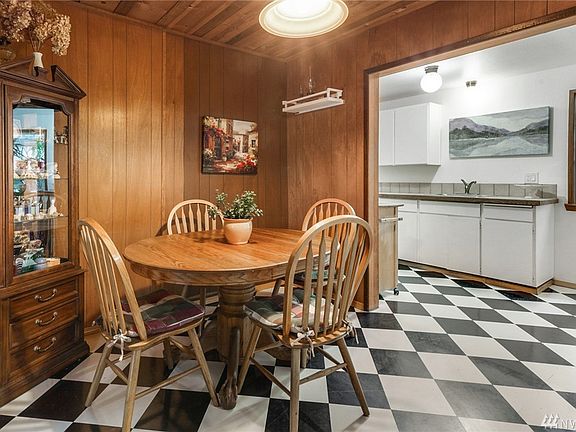 Fun black & white check floor tie the Dining Room & Kitchen spaces together. 