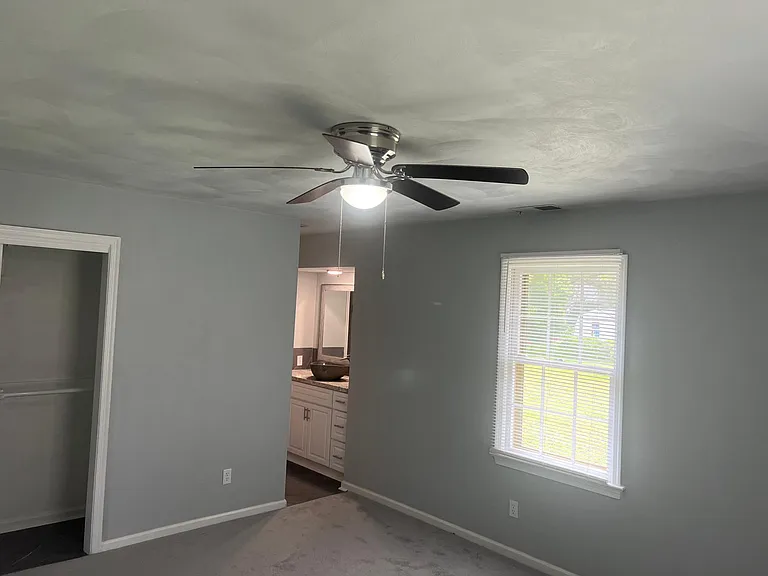 Large master bedroom with dual closets, dressing room with walk in closet and separate shower/ toilet room.